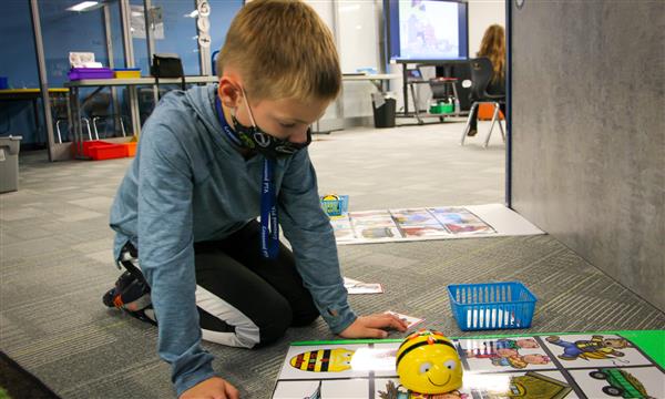Boy uses a BeeBot